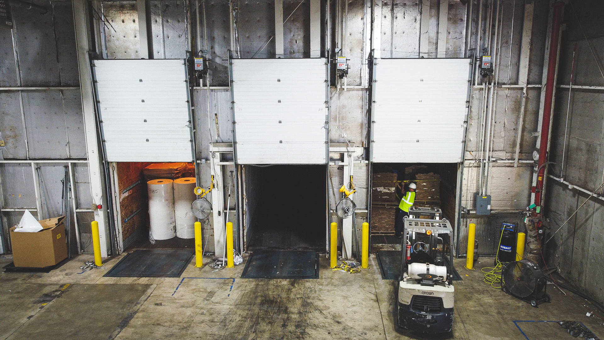 Employees receiving cardboard at the facility