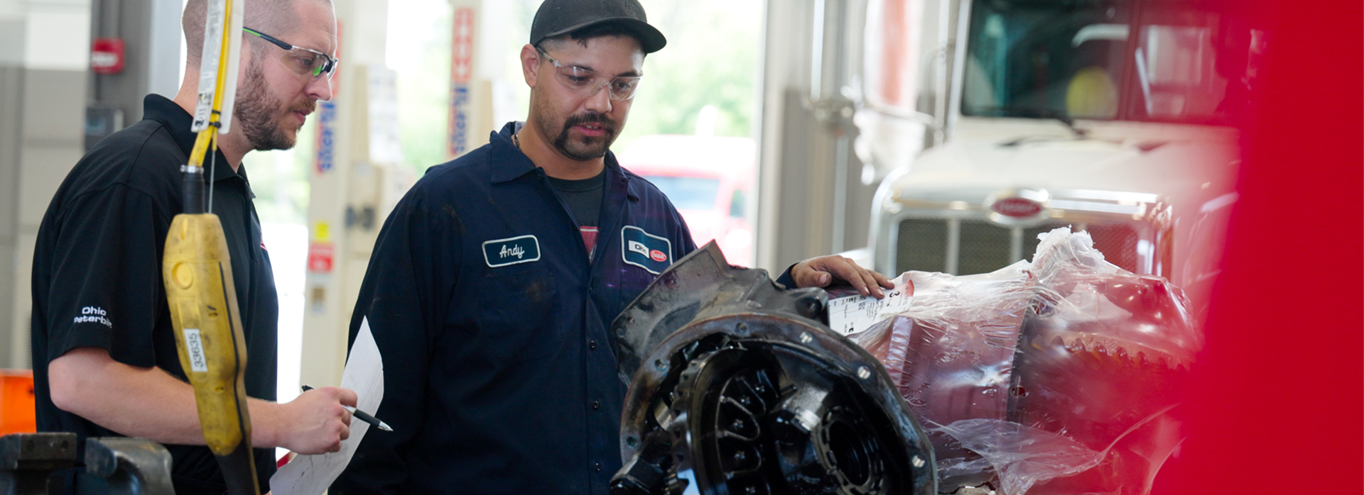 mechanics discussing machine parts