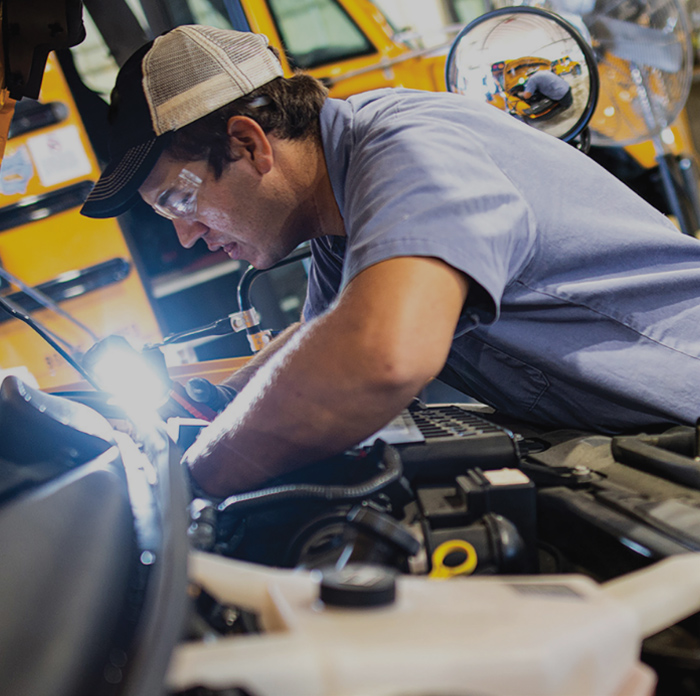 mechanic working on engine