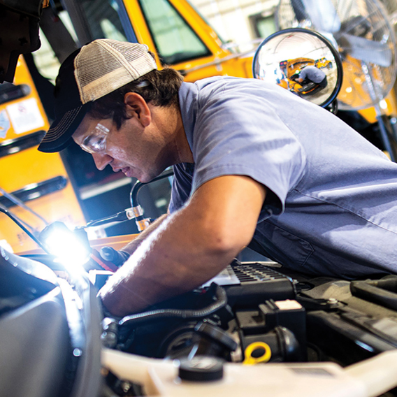 mechanic working on engine